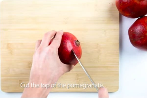 Cut the top of the Pomegranate 